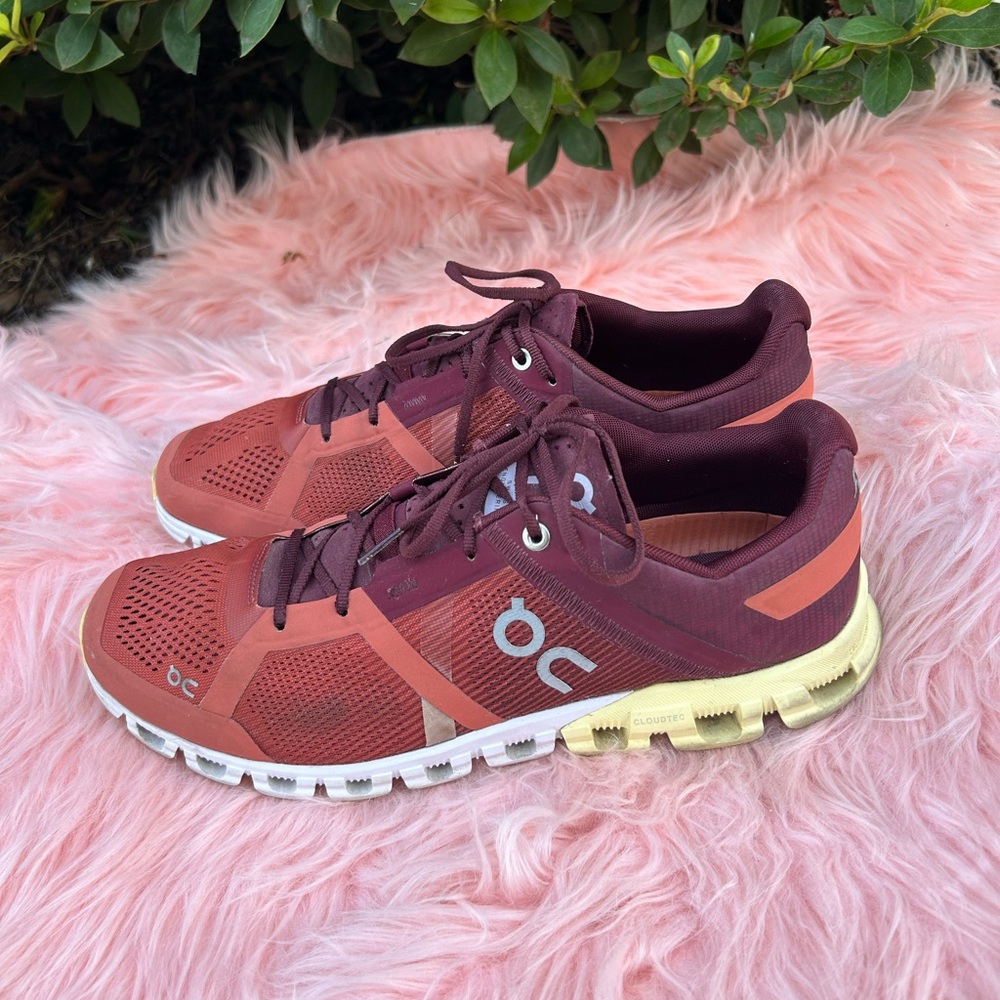On Running Red and Orange Athletic Shoes with CloudTec Cushioning